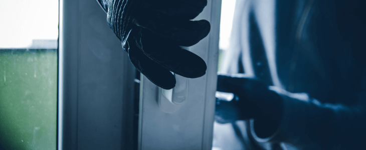 Man opening door to home